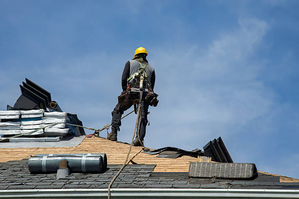 Professional Roofing technician working in South Kent, CT